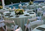 Renting Tables and Chairs for A Wedding Pastel Green Satin Table Cloths White Wood Padded Folding Chairs