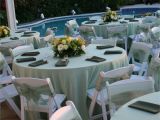 Renting Tables and Chairs for A Wedding Pastel Green Satin Table Cloths White Wood Padded Folding Chairs
