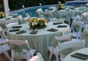 Renting Tables and Chairs for A Wedding Pastel Green Satin Table Cloths White Wood Padded Folding Chairs