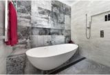 Semi Freestanding Bathtub Designer Tiles and A Semi Freestanding Tub are Features Of
