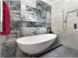 Semi Freestanding Bathtub Designer Tiles and A Semi Freestanding Tub are Features Of