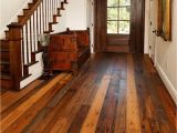 Using Wood Flooring On Walls Foyer Designed with White Walls and Recycled Wood Flooring