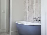 Vertical Bathtub Tub Nook with Herringbone Tiled Accent Wall Contemporary