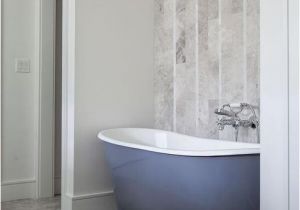 Vertical Bathtub Tub Nook with Herringbone Tiled Accent Wall Contemporary