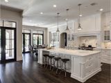 What is the Cheapest Flooring for A Kitchen Love the Contrast Of White and Dark Wood Floors by Simmons Estate