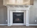 White Quartz Fireplace Surround Cozy Up to This Fireplace Surrounded with White Subway Tile and